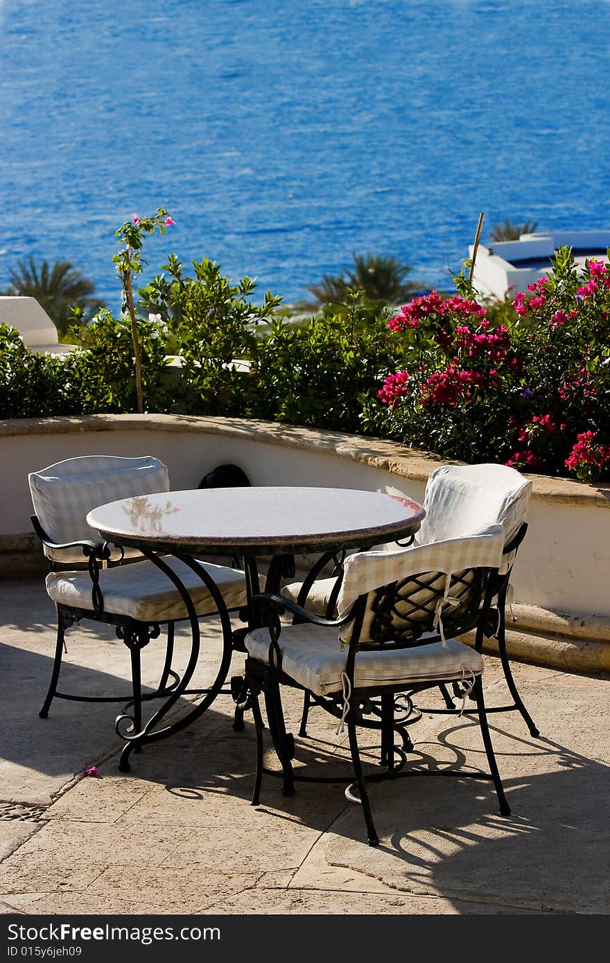 Empty table in the cafe at side of sea.