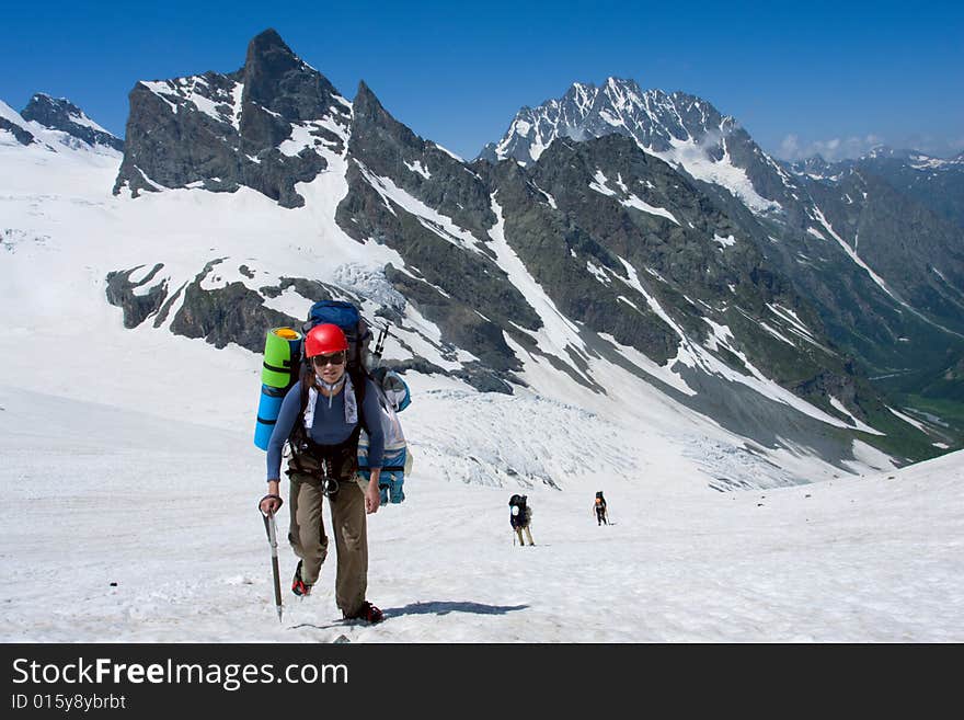 Group of tourist hiking in high mountains. Group of tourist hiking in high mountains