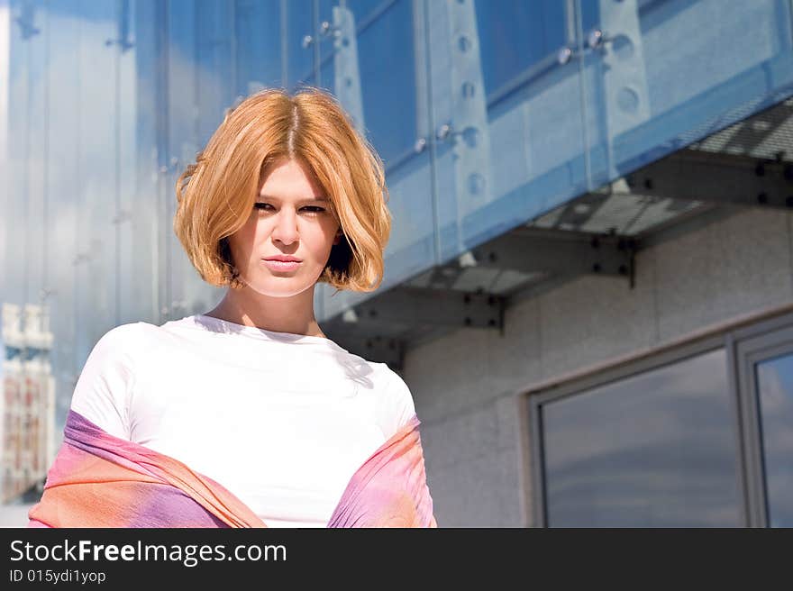 One woman in front of modern building