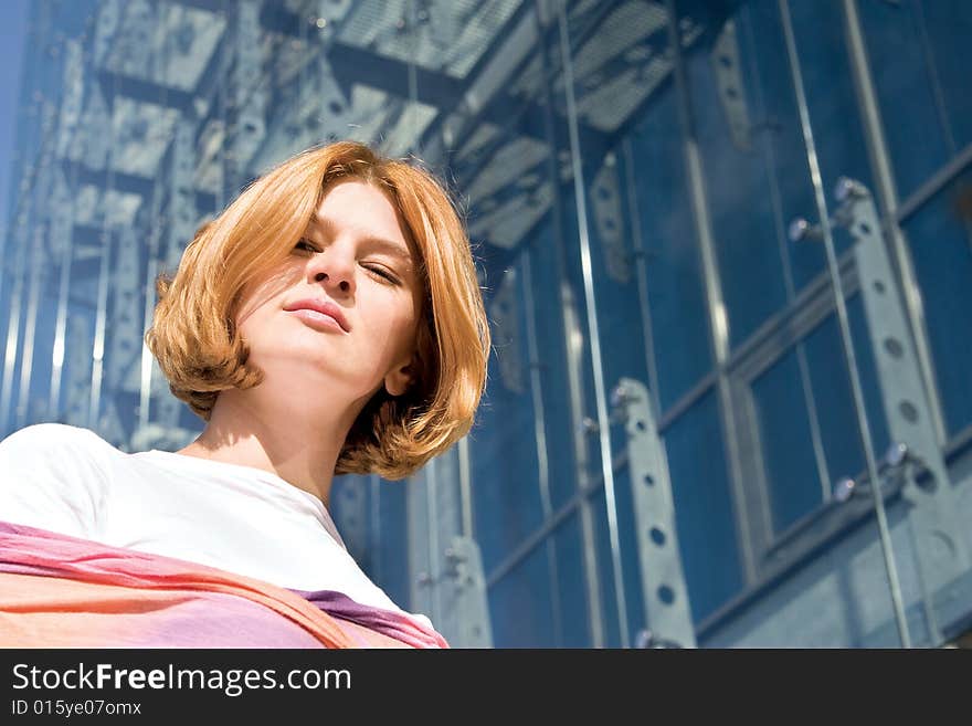 One woman in front of modern building