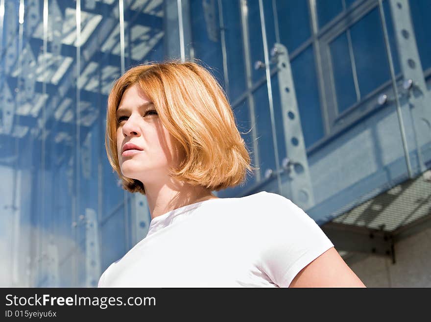 One woman in front of modern building