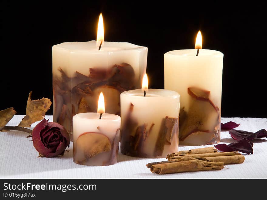 An aromatic candlelight in black background. An aromatic candlelight in black background