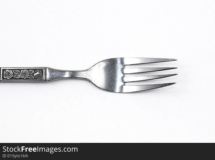 A Silver fork on a White Clean background