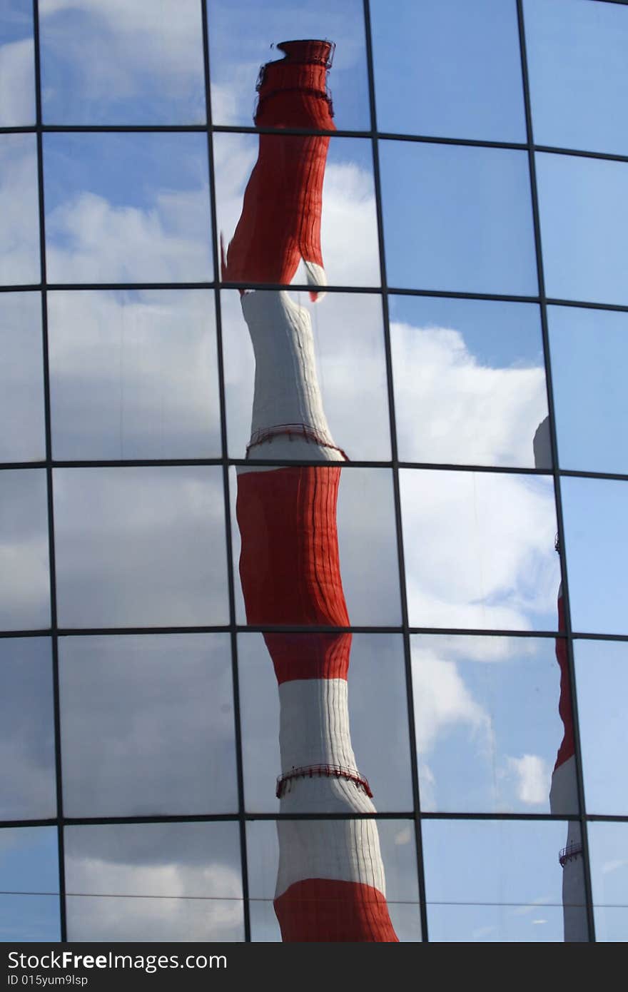 This is pipe's reflection. Pipe of Central Heating and Power Plant in center of city. This is pipe's reflection. Pipe of Central Heating and Power Plant in center of city.