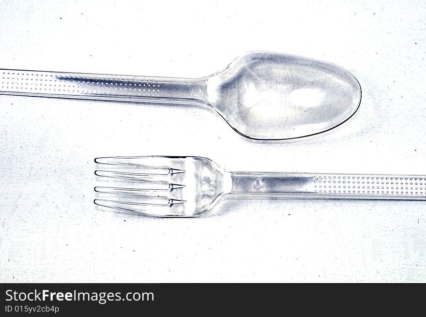 Plastic Spoon and Fork on a White Background