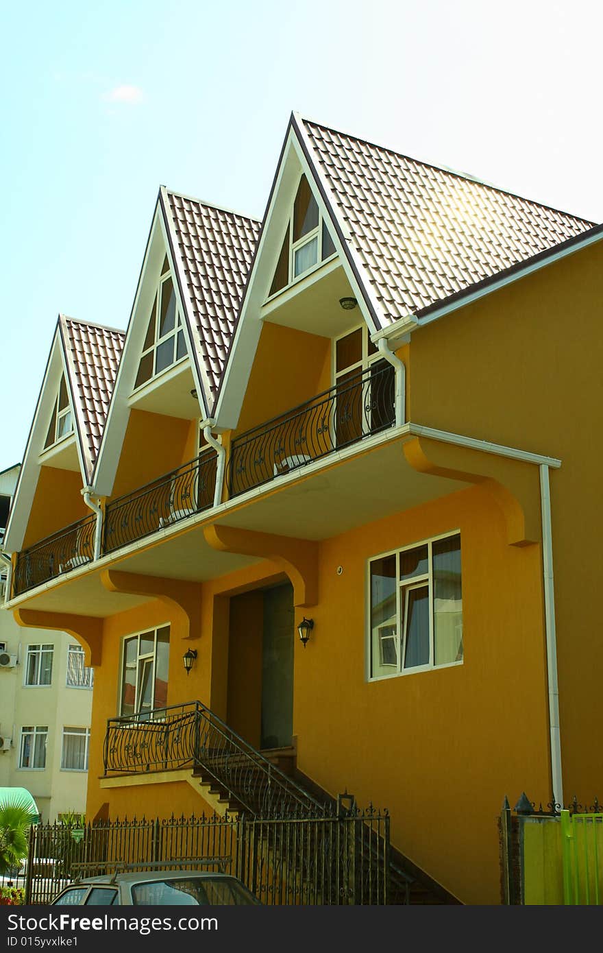 Orange country house with three floors