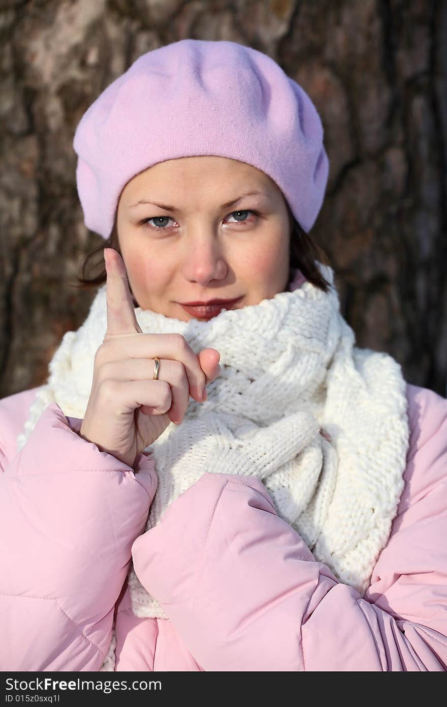 Smiling and strict girl in pink beret