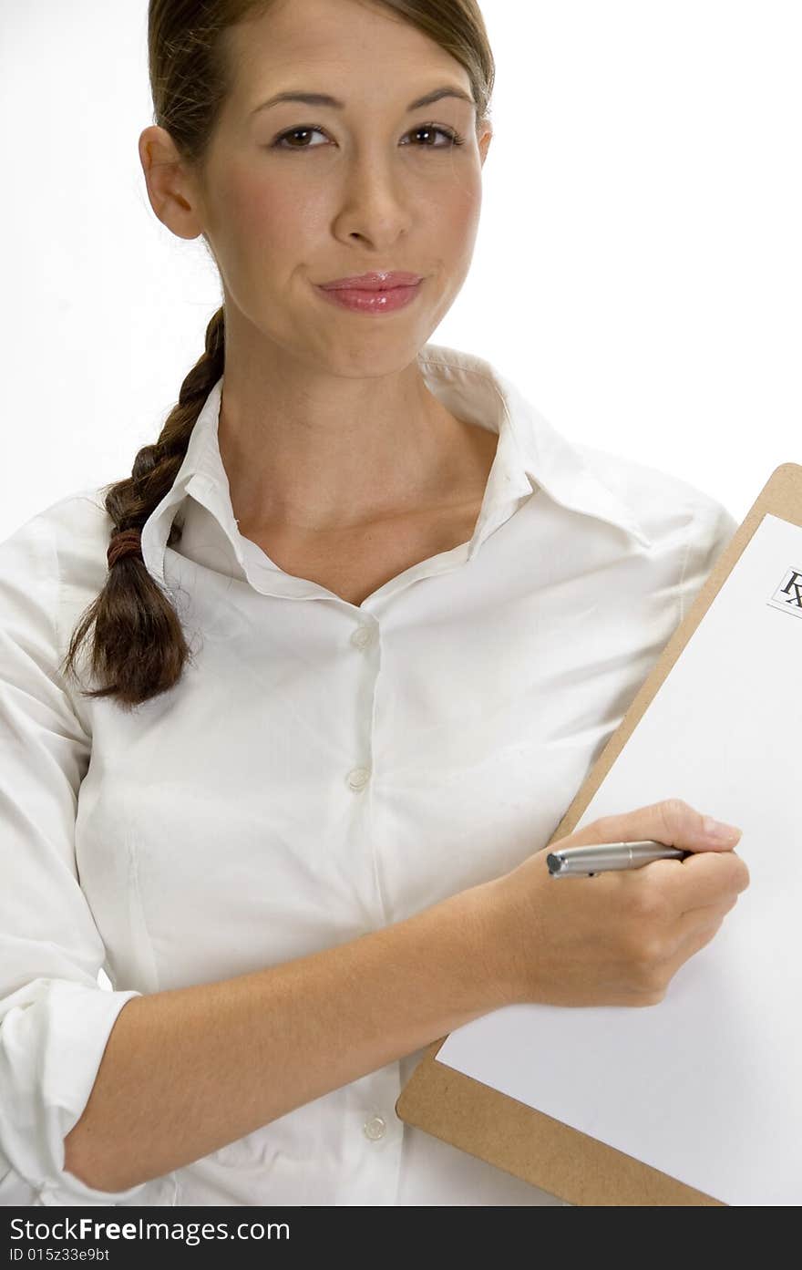 Portrait of young doctor busy with writing pad