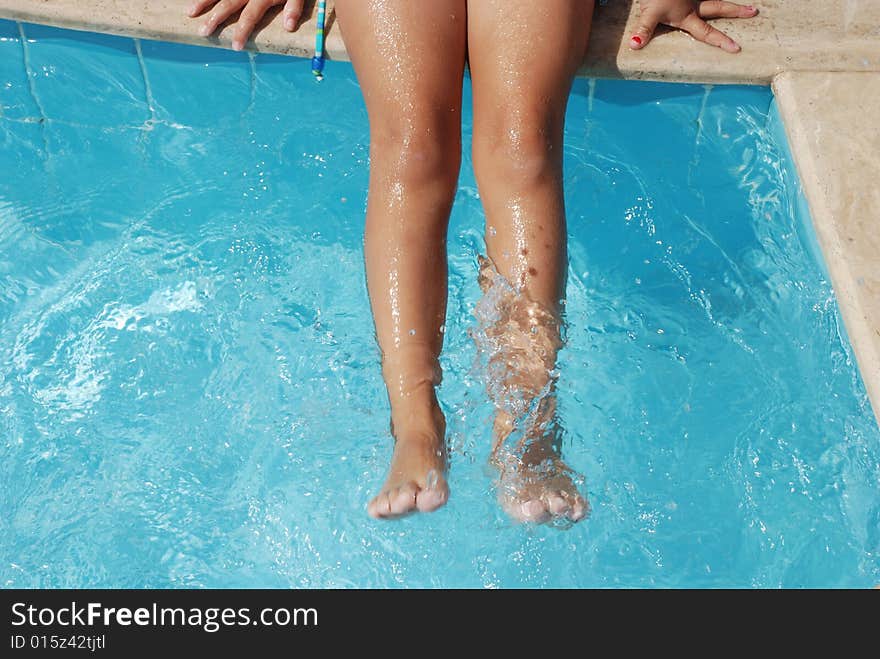 Child leg near swimming pool