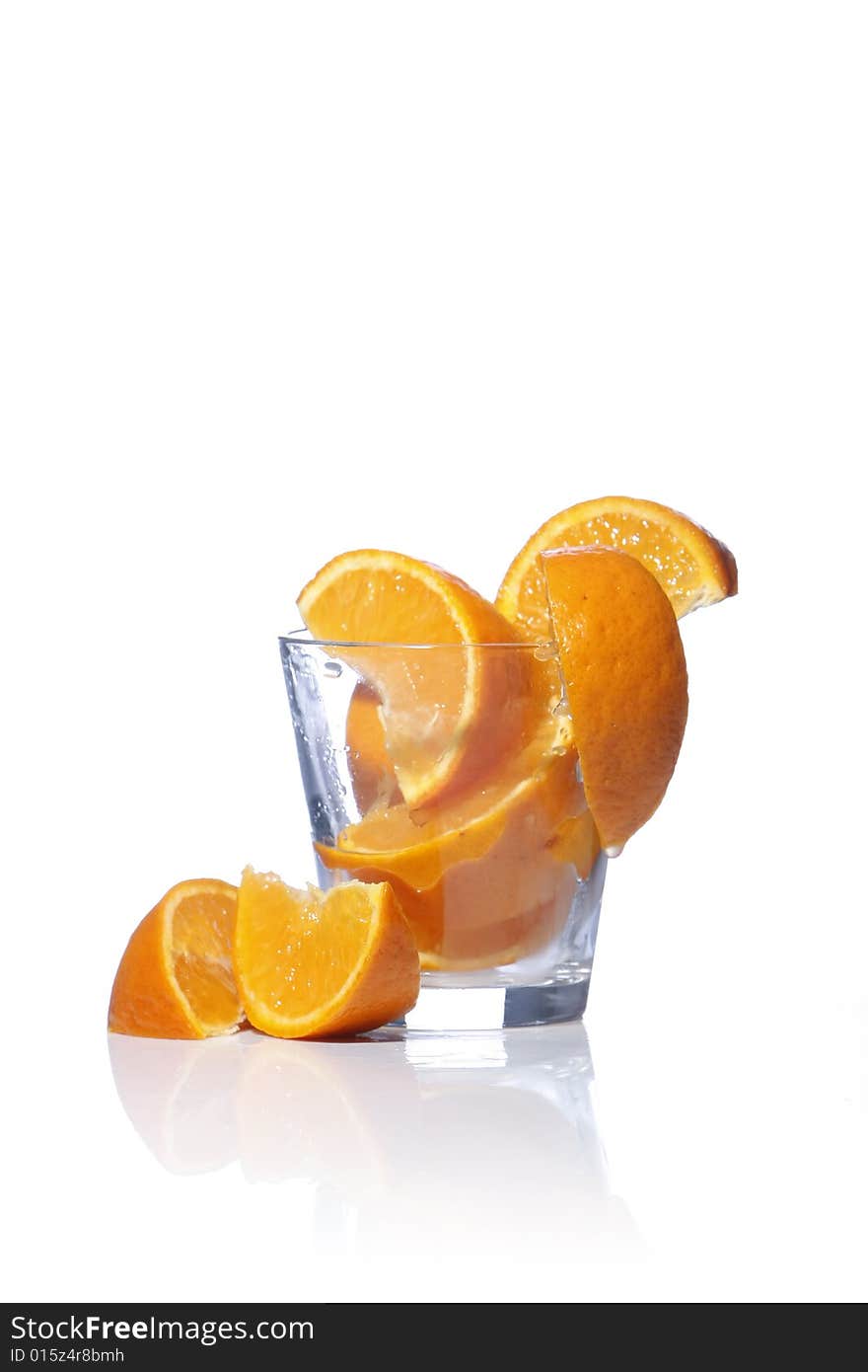 Orange slices in glass isolated in white background