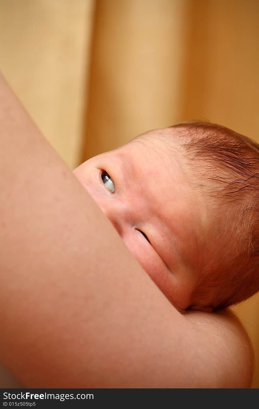 Cunning toddler on the mothers' hands