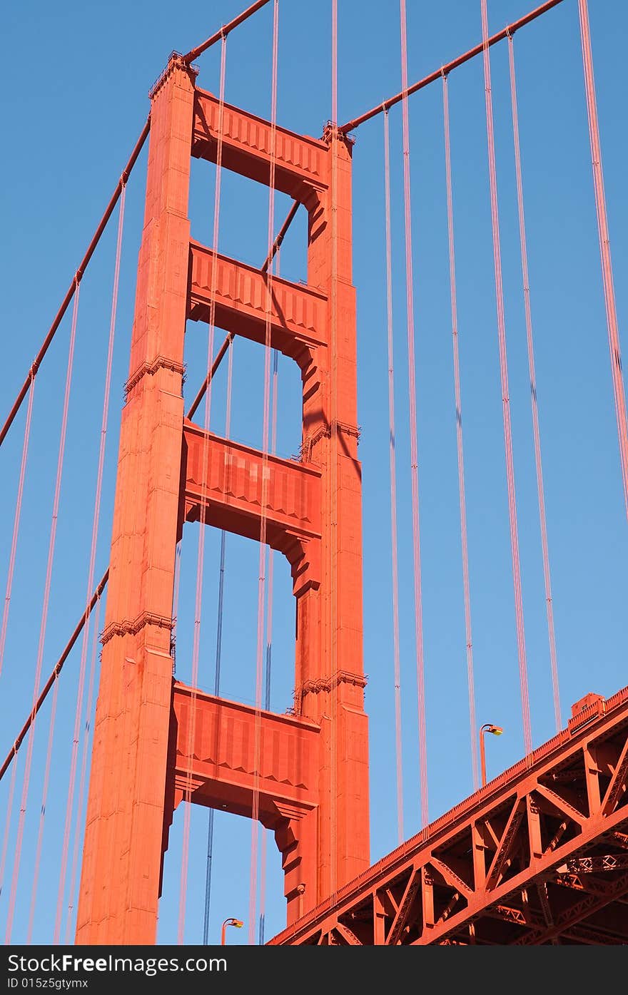 Golden gate bridge tower against blue sky