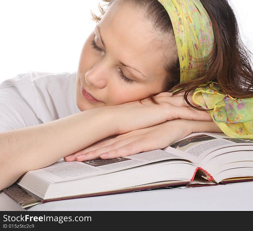 Beautiful girl with green headscarf sleeping on book. Beautiful girl with green headscarf sleeping on book