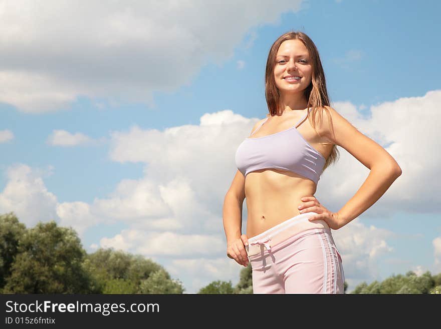 Beauty young woman on sky background