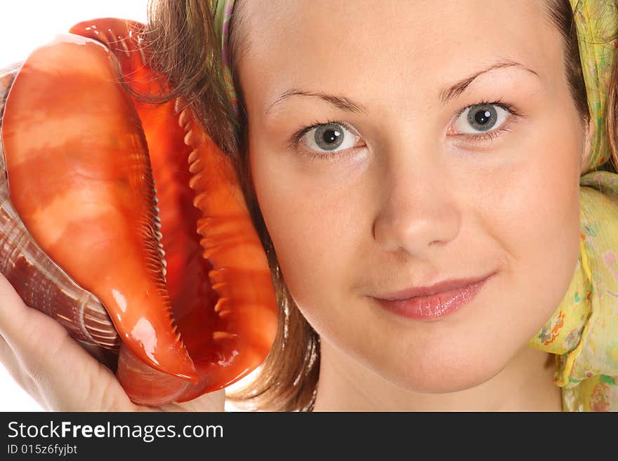 Portrait of Beautiful model with green headscarf and red sea shell