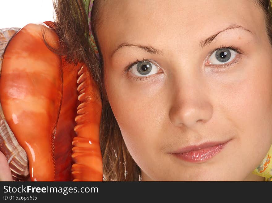 Portrait of Beautiful model with green headscarf and red sea shell