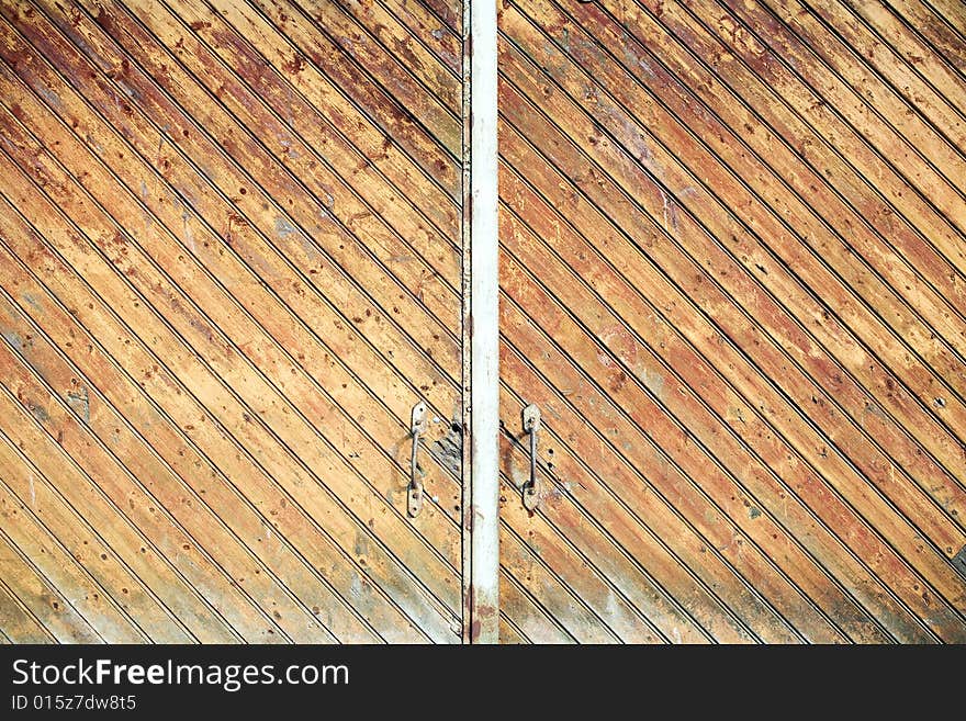 Old wooden weathered warehouse doors. Old wooden weathered warehouse doors