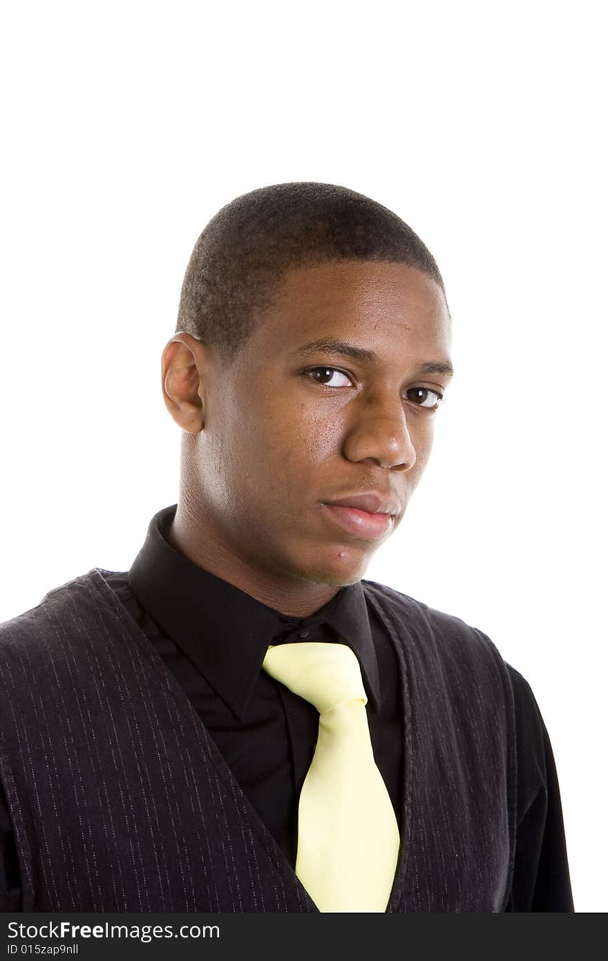 A young black man in a yellow tie, looking at camera with nice eyes. A young black man in a yellow tie, looking at camera with nice eyes