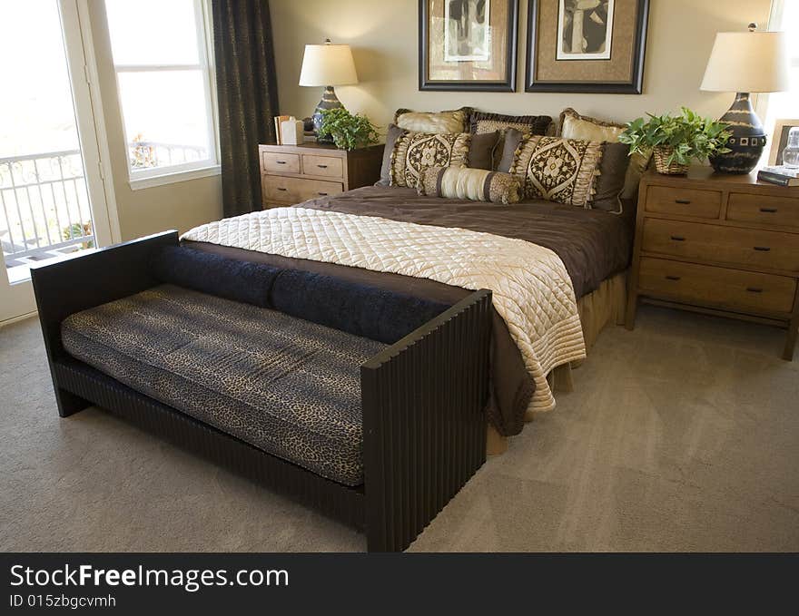 Comfortable modern designer bedroom with stylish furniture and decor. Comfortable modern designer bedroom with stylish furniture and decor.