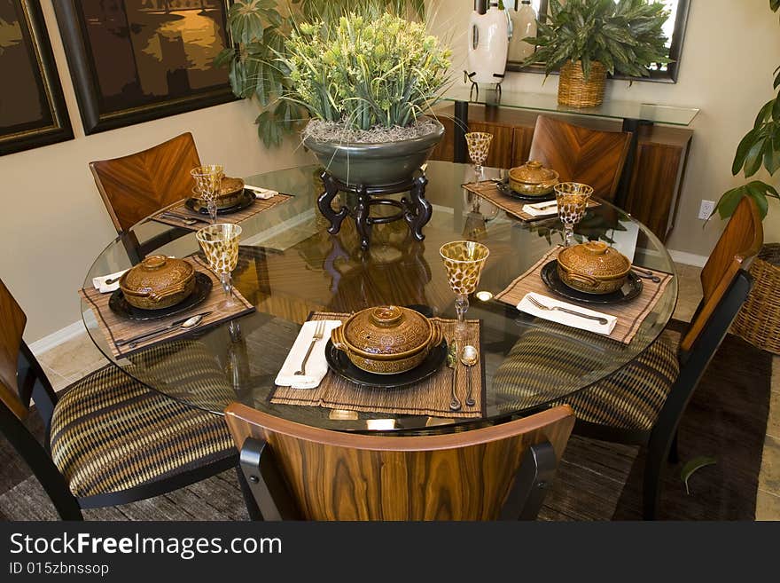 Dining table with modern tableware and decor. Dining table with modern tableware and decor.