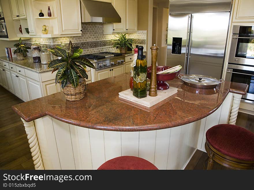 Luxury kitchen with a modern granite island. Luxury kitchen with a modern granite island.