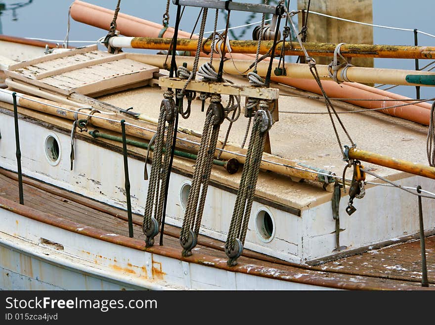 An old wooden sailboat under repair. An old wooden sailboat under repair