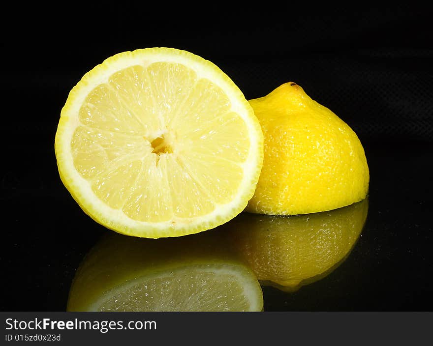 Bright lemon yellow juicy fruit on a dark background