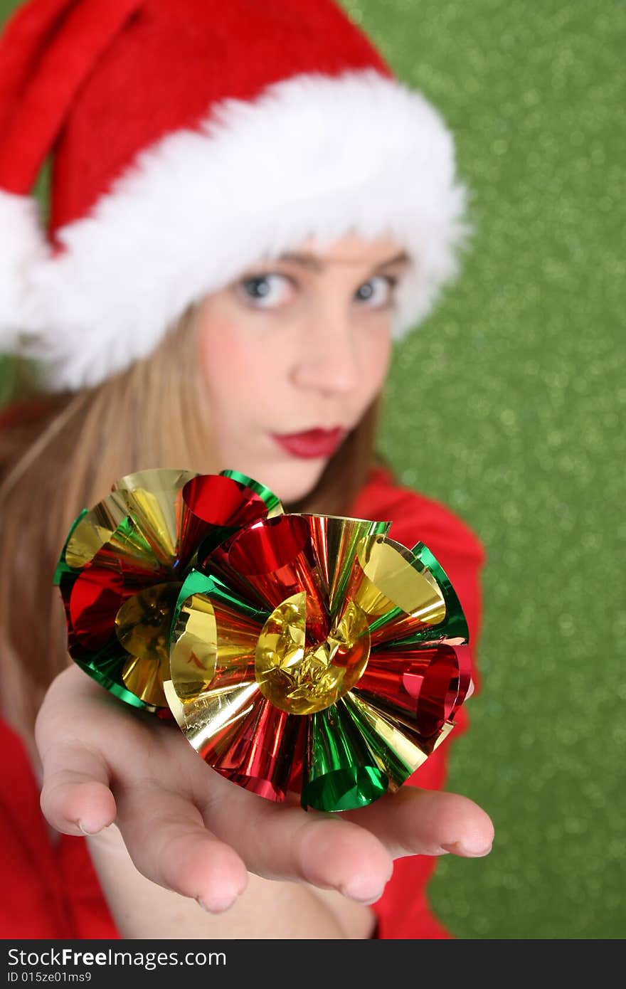 Christmas teen holding decorations.  FOCUS on decorations.