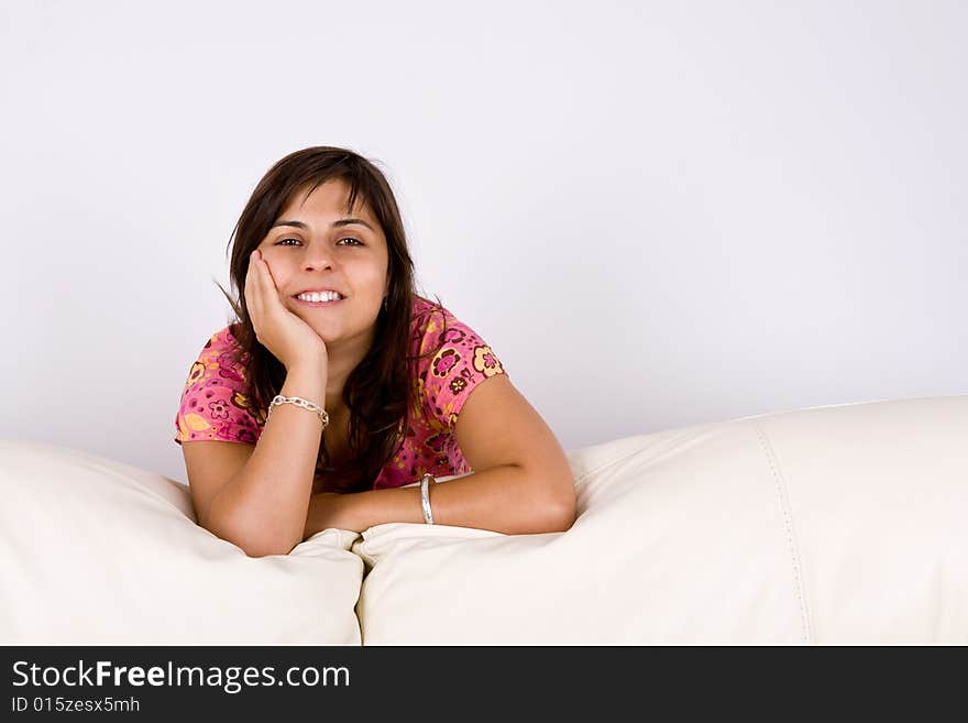 Beautiful young girl on sofa