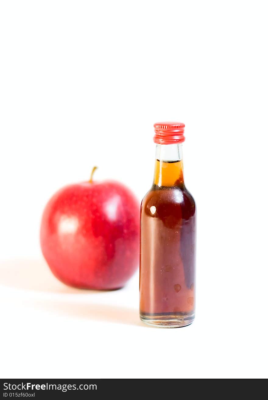 Bottle and apple isolated on white for your design