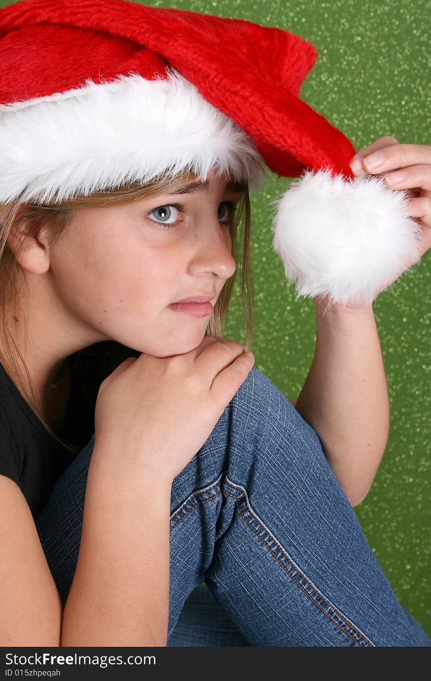 Beautiful teenager girl wearing a christmas hat. Beautiful teenager girl wearing a christmas hat