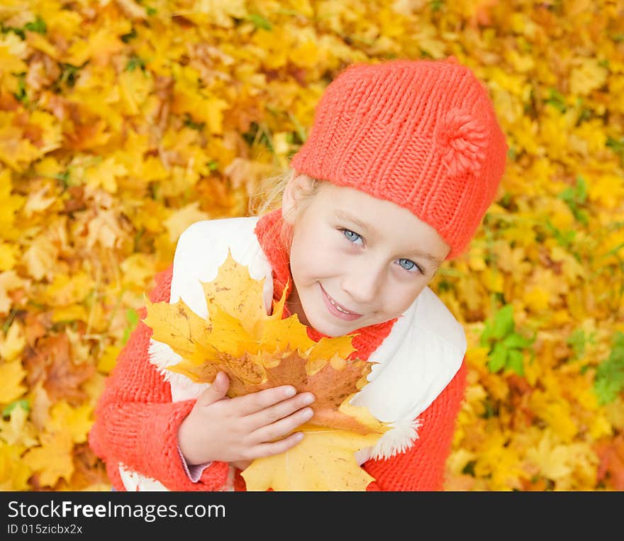 Girl with autumn leaves