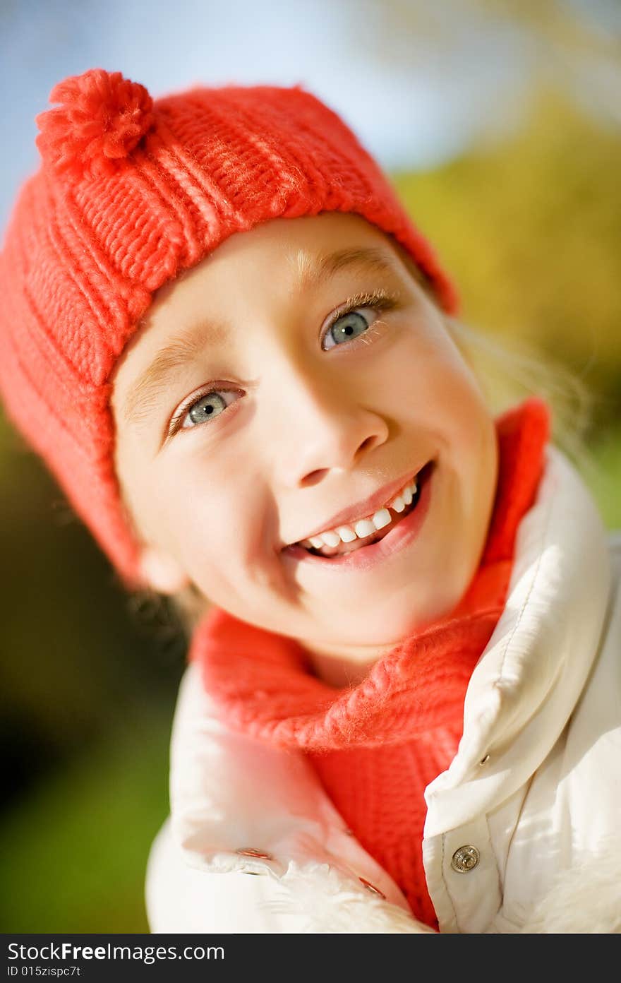 Adorable little girl outdoors. Close-up portrait