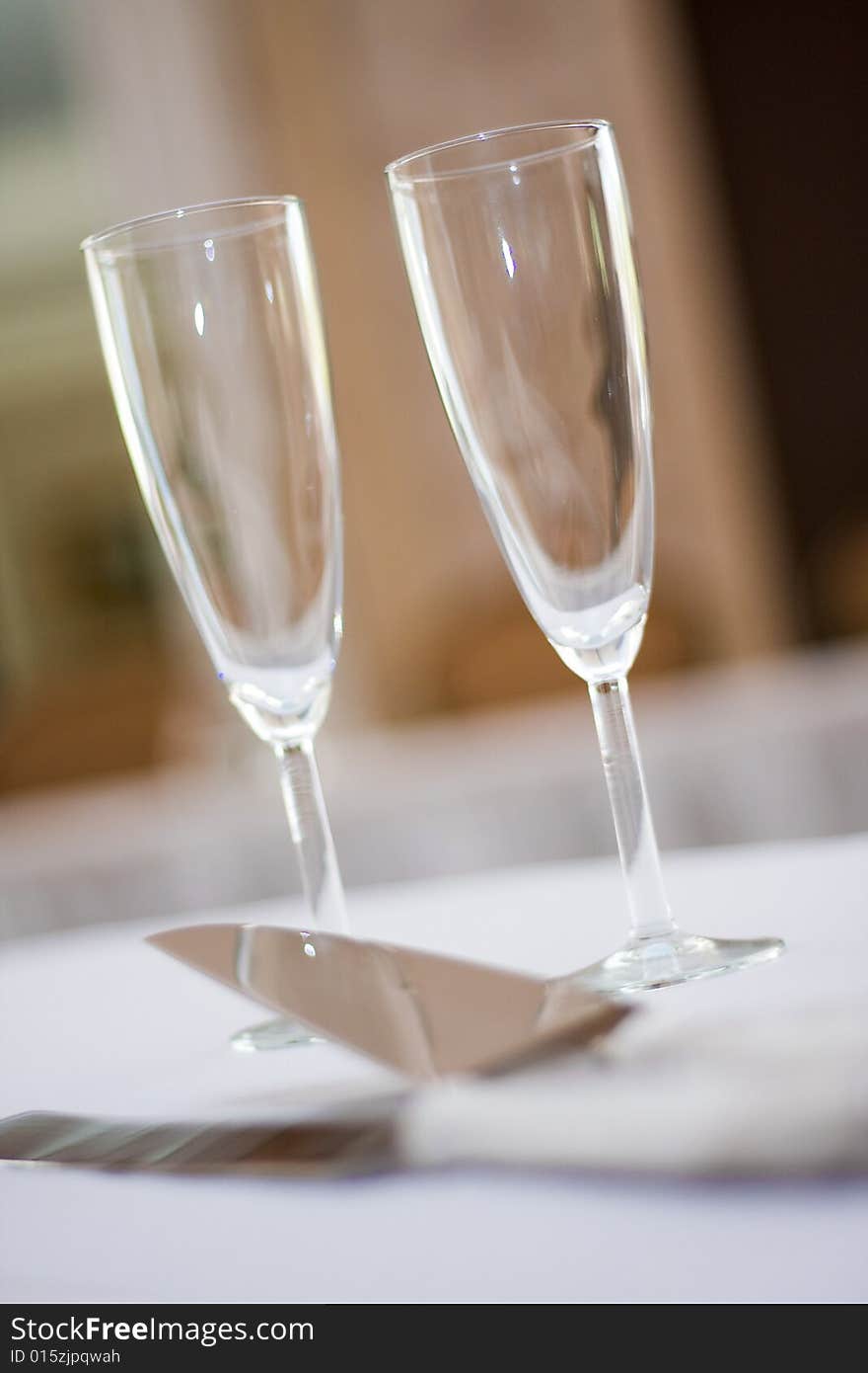 Champagne glasses sitting on a table at wedding