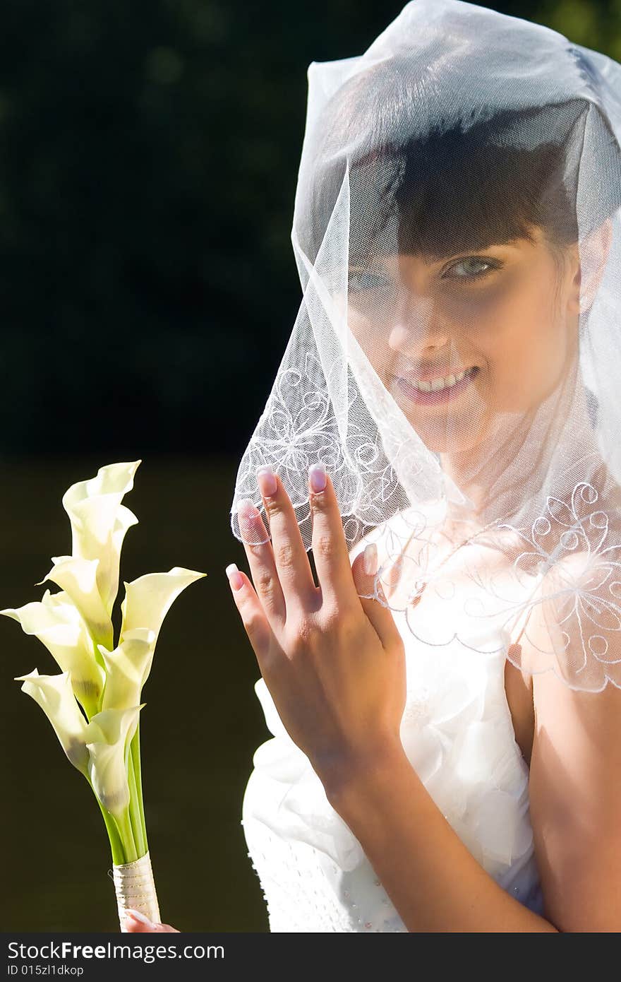 Smiling bride with bouquet