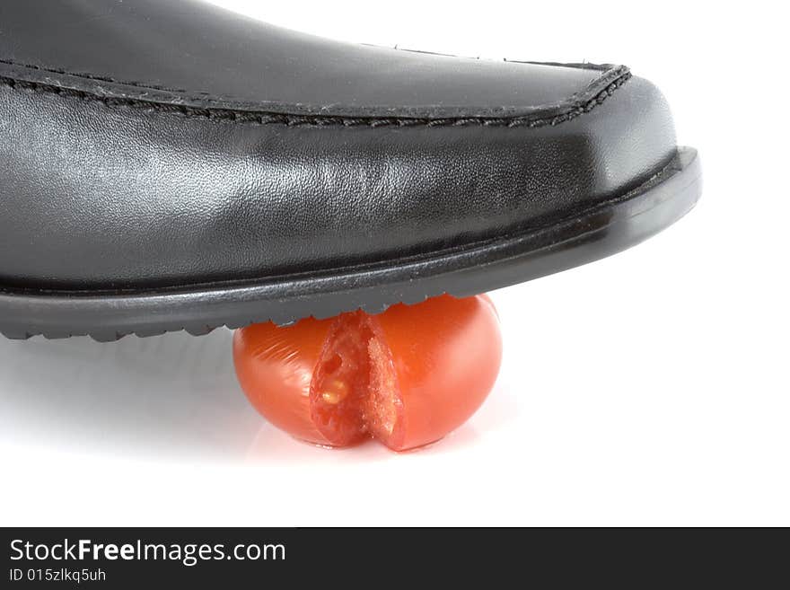 Tomato cracked under shoe pressure. Tomato cracked under shoe pressure