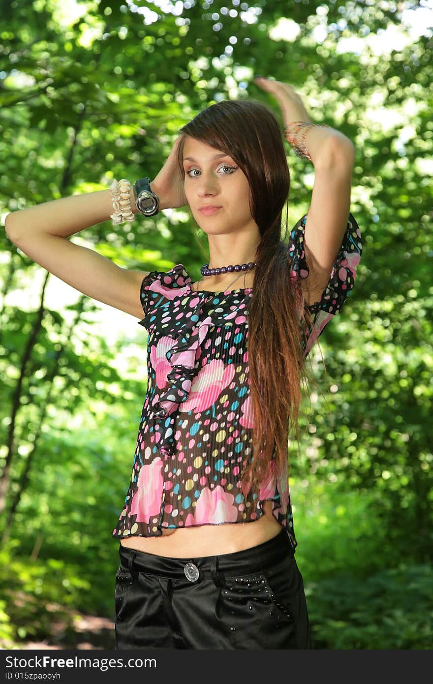 Young beauty girl in wood