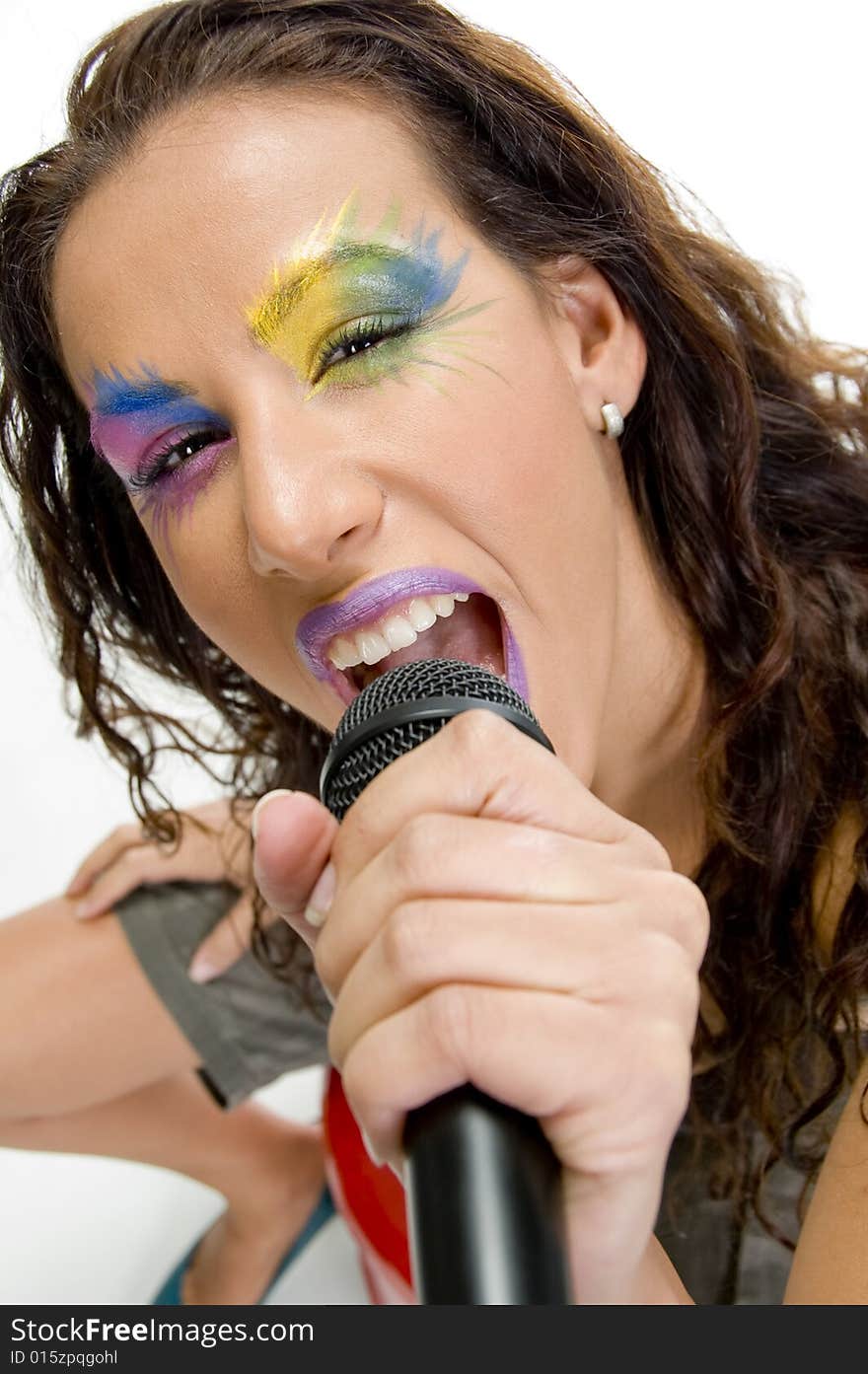 Close up of woman singing into microphone