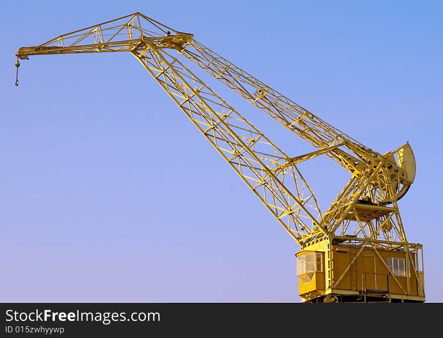 Old Crane with a blue sky in the background.