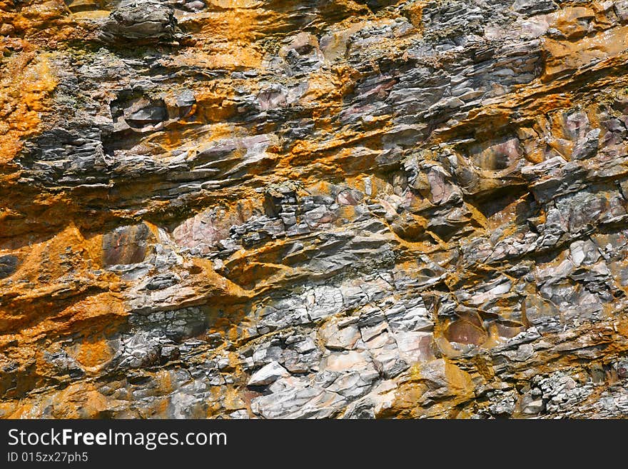 Close-up of a yellow - grey rock background