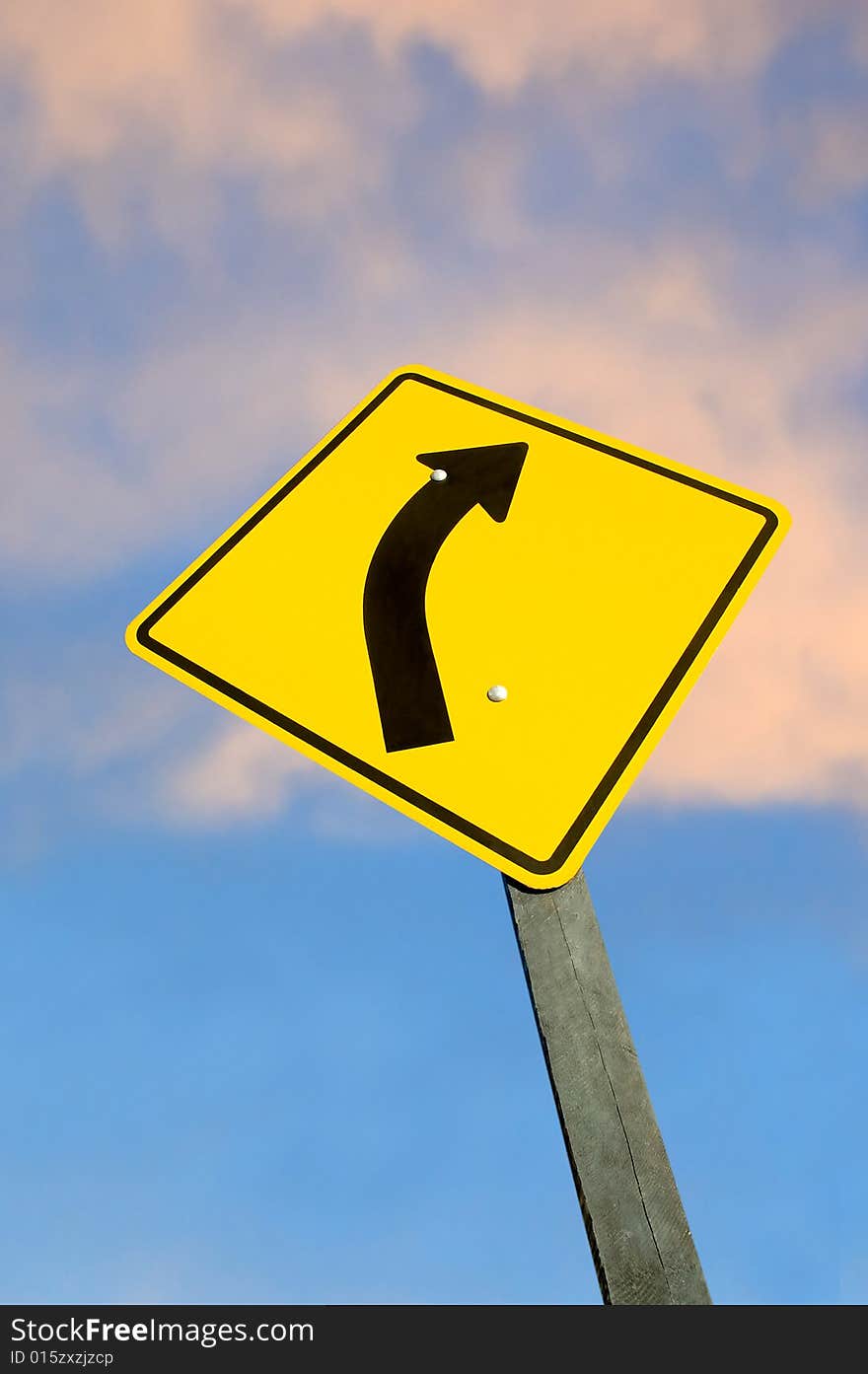 Road sign against sky at dusk with clipping path.