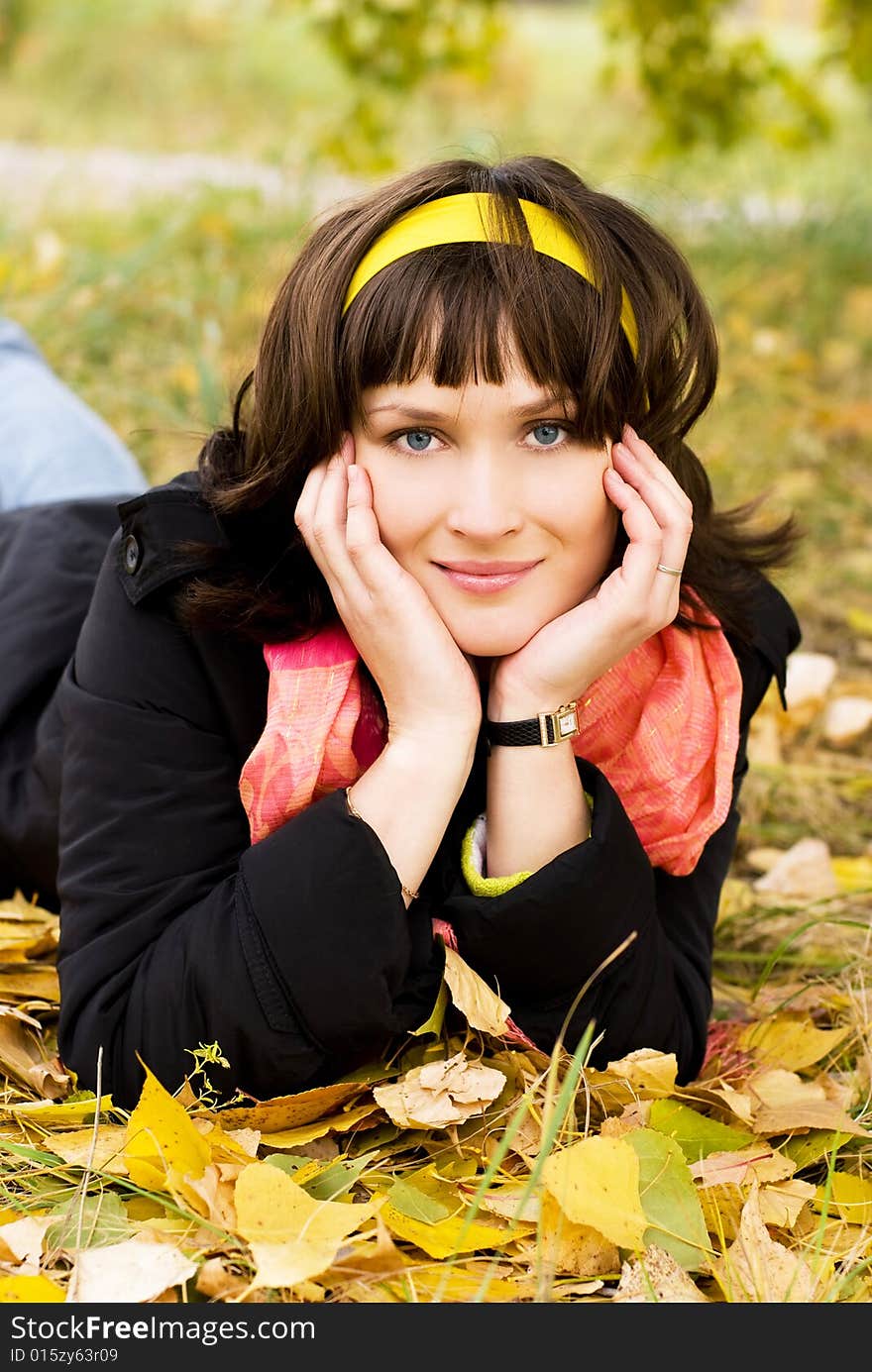 Beautiful girl in the park on the grass