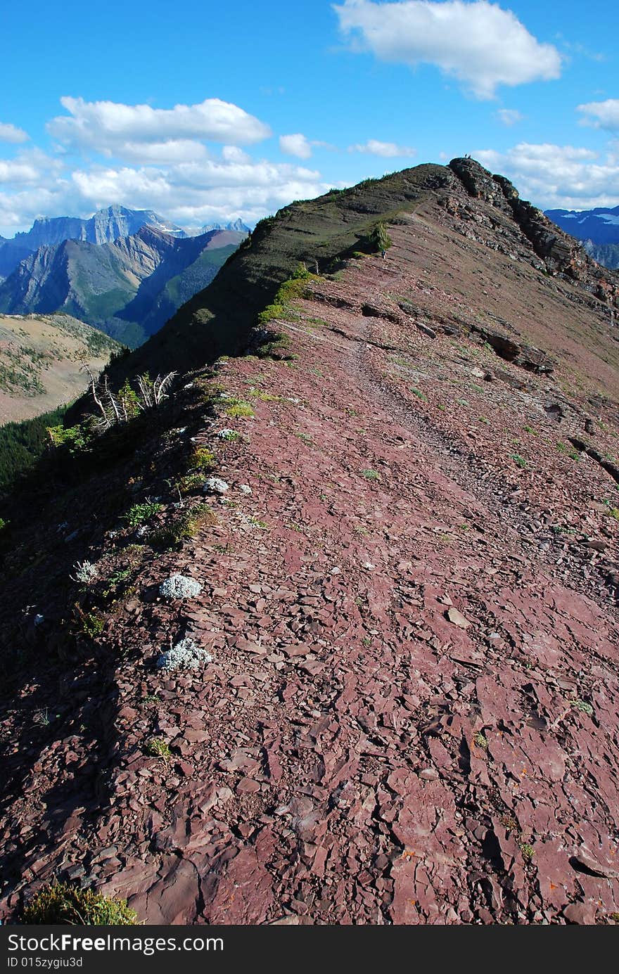 A red color mountain peak on Carthew-Alderson Trail in Waterton National Park Alberta Canada. A red color mountain peak on Carthew-Alderson Trail in Waterton National Park Alberta Canada