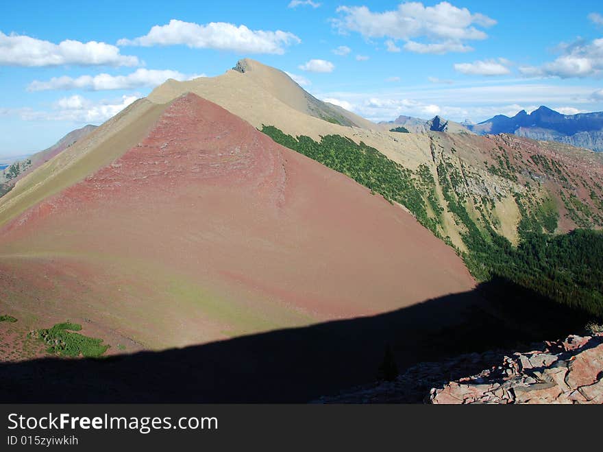 A red color mountain peak on Carthew-Alderson Trail in Waterton National Park Alberta Canada. A red color mountain peak on Carthew-Alderson Trail in Waterton National Park Alberta Canada