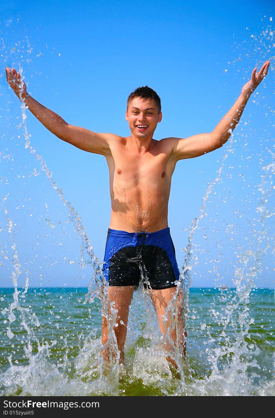 Man in sea water splash