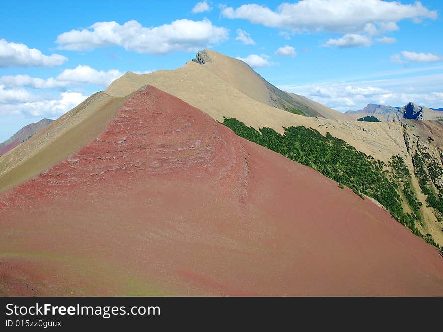 A red color mountain peak on Carthew-Alderson Trail in Waterton National Park Alberta Canada. A red color mountain peak on Carthew-Alderson Trail in Waterton National Park Alberta Canada