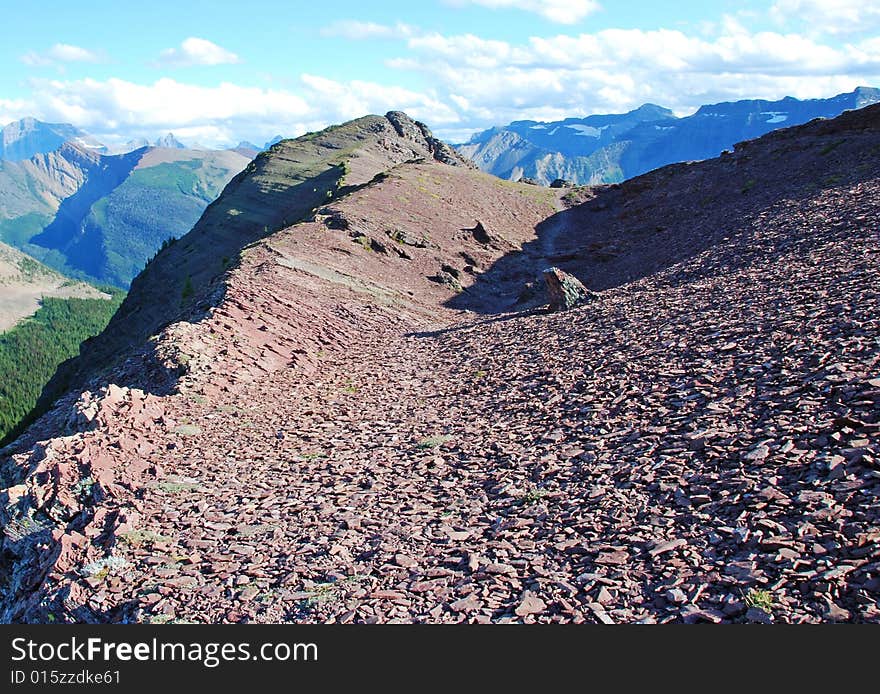 A red color mountain peak on Carthew-Alderson Trail in Waterton National Park Alberta Canada. A red color mountain peak on Carthew-Alderson Trail in Waterton National Park Alberta Canada