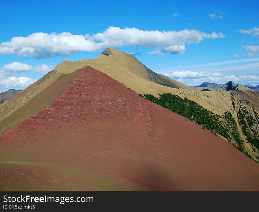 A red color mountain peak on Carthew-Alderson Trail in Waterton National Park Alberta Canada. A red color mountain peak on Carthew-Alderson Trail in Waterton National Park Alberta Canada