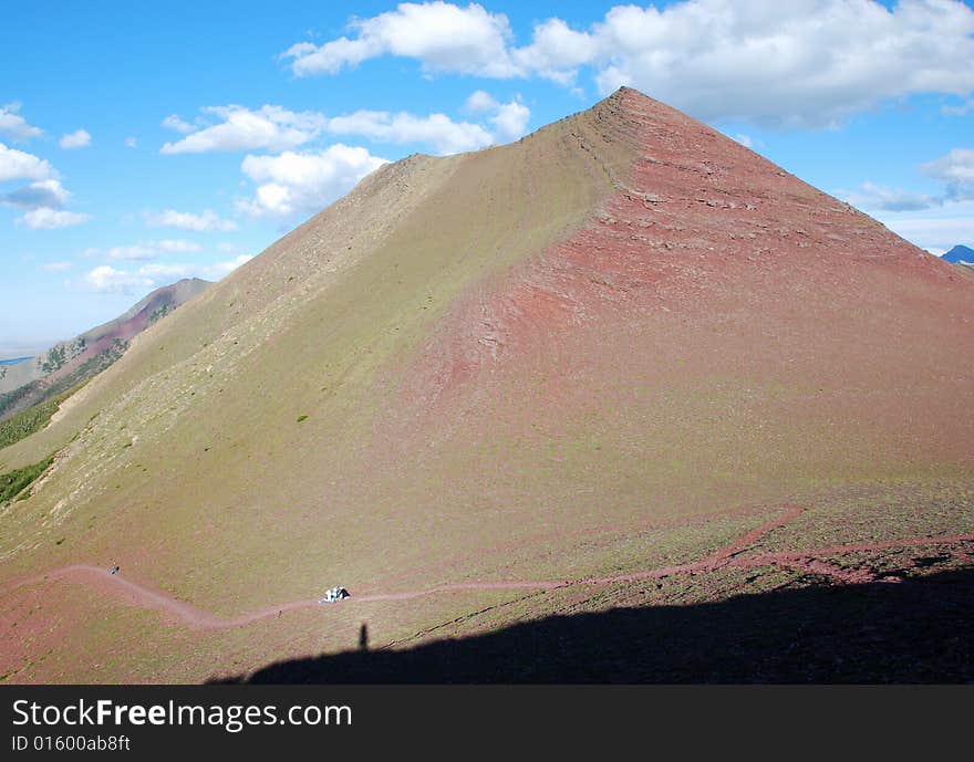 A red color mountain peak on Carthew-Alderson Trail in Waterton National Park Alberta Canada. A red color mountain peak on Carthew-Alderson Trail in Waterton National Park Alberta Canada