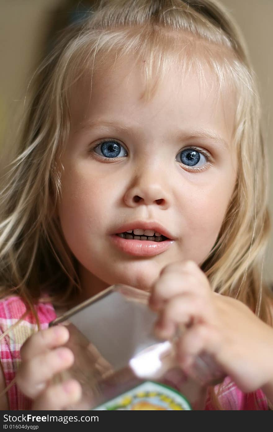 Portrait of the small beautiful girl